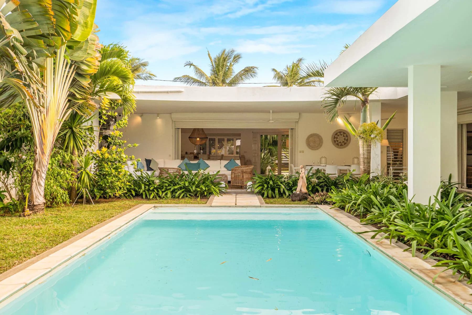 Villa White Horizon, a contemporary concrete villa arranged around a pool in Grand Baie